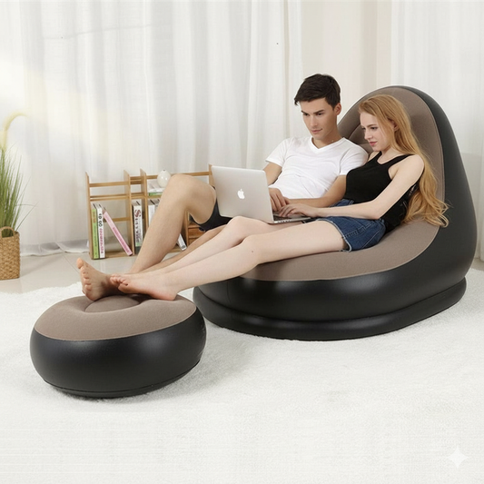 Two people using a modern inflatable sofa and ottoman in a living room setting.